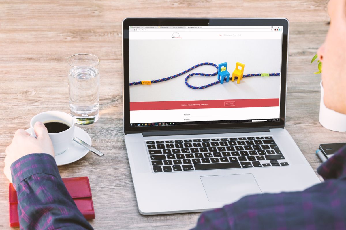 Corporate website open on a laptop